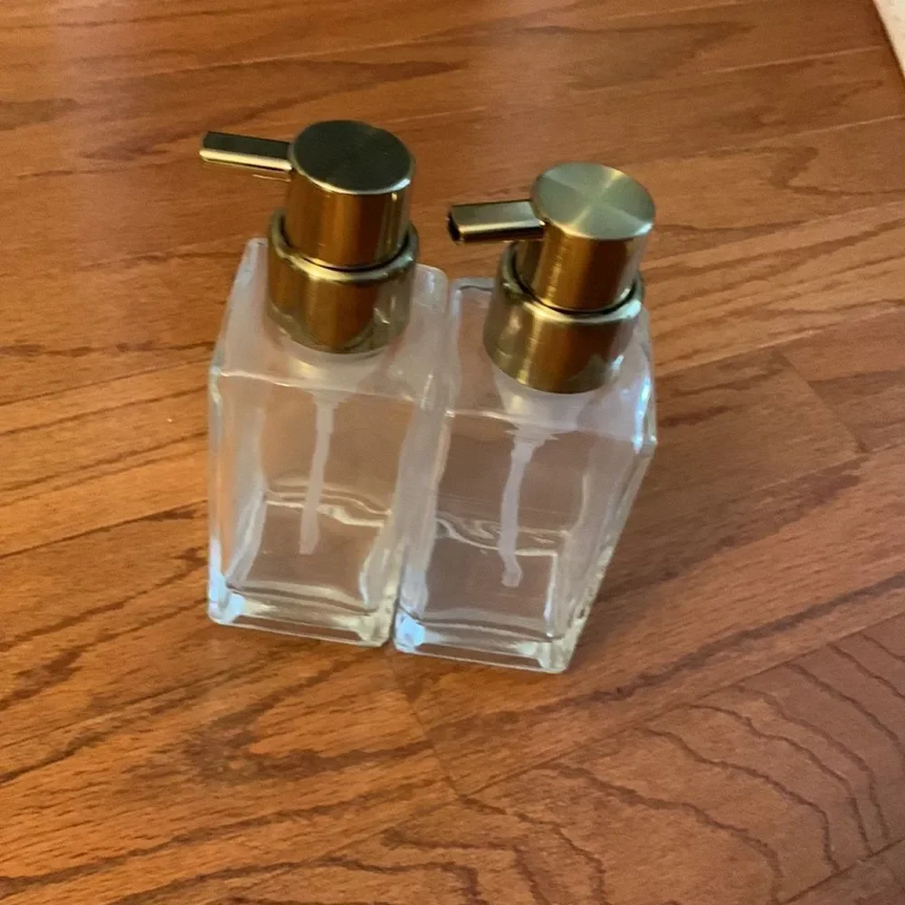 Set of TWO pump bottle refillable dispensers with goldtone tops